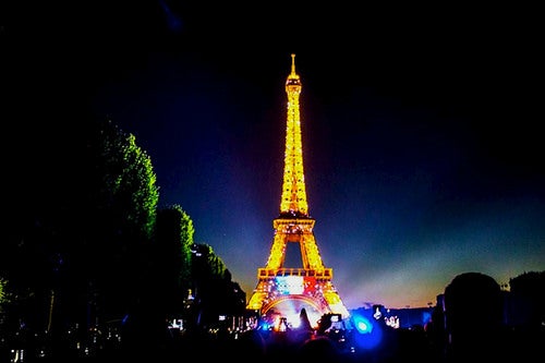 The Eiffel Tower, lit up for Bastille Day.