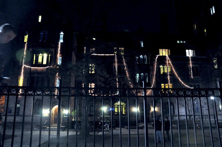 &quot;HOUN&quot; spelled out on the outside of the Calhoun College freshmen residence hall with Christmas lights.