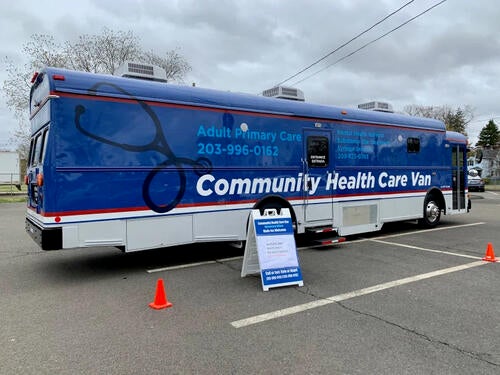 A blue bus that reads &quot;Community Healthcare.&quot;