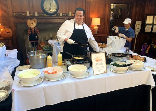 A Yale Dining staff member cooking custom omelettes at the Master's Brunch.