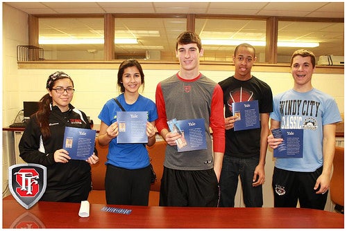 High school students with Yale brochures and fliers.
