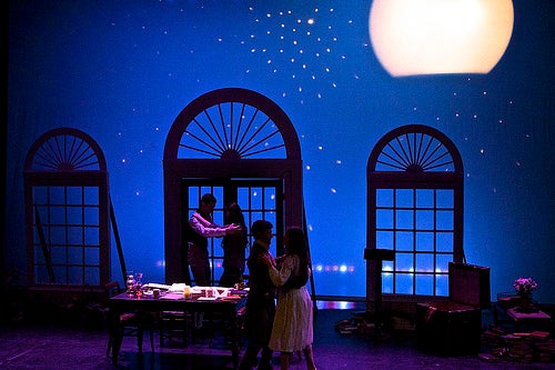 Two couples dance in a dining room under the moon and stars, from Dramat's freshman show.
