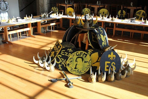 Hand-painted Ezra Stiles shields, viking hats and weapons piled in the center of the dining Hall.
