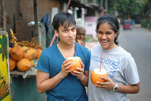 The Author with their co-leader, drinking king coconut water straight from the coconut.