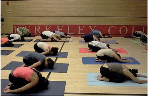 &quot;Yogis at Yale&quot; class members holding a pose.