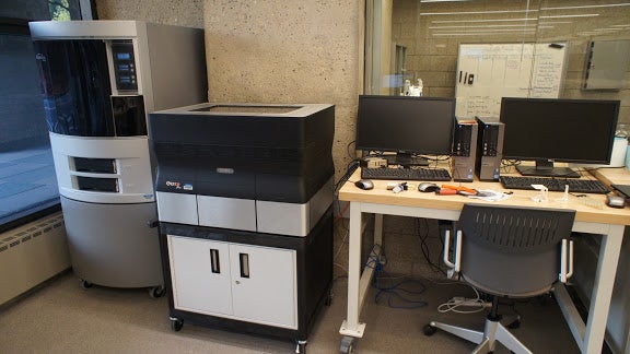 Two different 3D Printers, with a computer workstation for each.