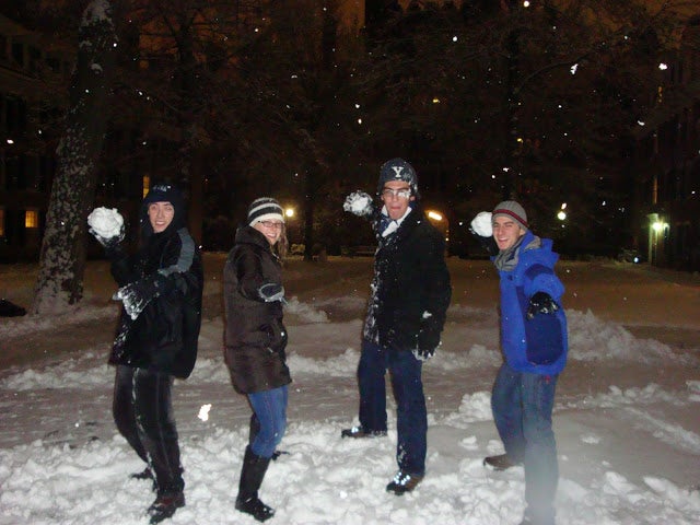 The author's friends with snowballs in hand, taking aim directly at him.