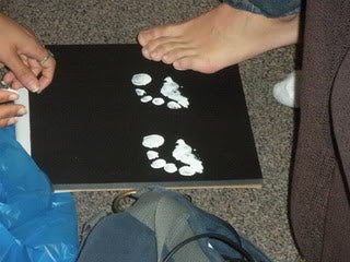 A student leaving a paint footprint.