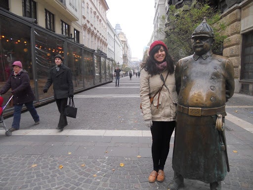 Michelle with a statue of a patrolman in Budapest.