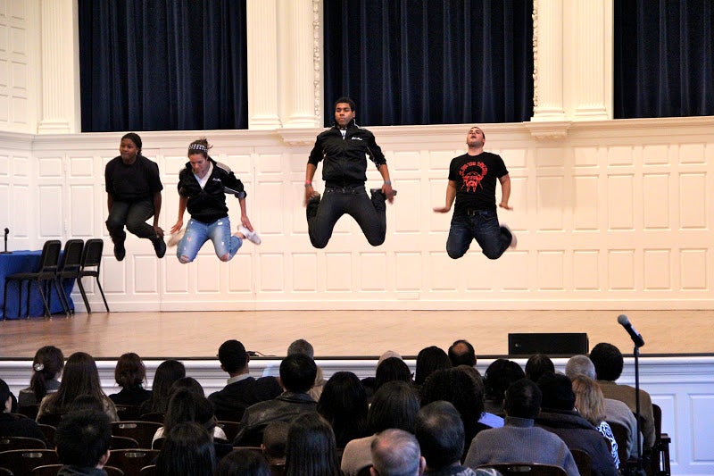 A performance group in a synchronized high-jump.