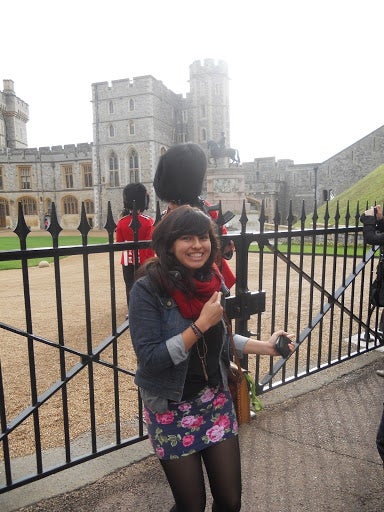 Michelle gives a thumbs-up for the Queen's Guard at a gate to Windsor Castle.