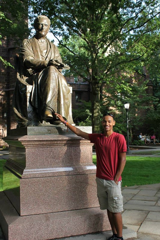 Author Tobias rubbing the &quot;good luck foot&quot; of the Theodore Dwight Woolsey statue.