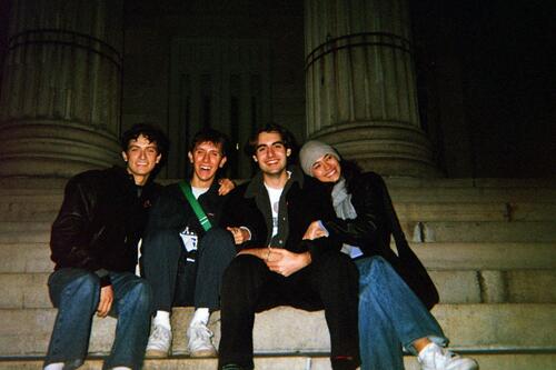Me and a few cast members sitting outside the Hall of Justice in Brooklyn, smiling for the camera