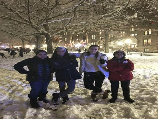 4 girls pose in the snow