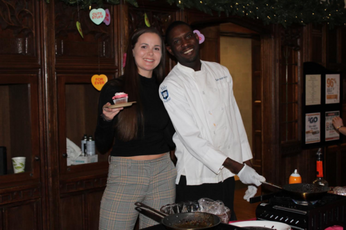 two people, Lydia and dining hall worker Tim, pose together for Valentines Day