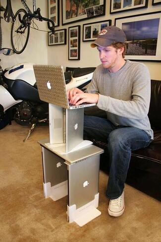 Laptop stand made out of stacked Macbooks