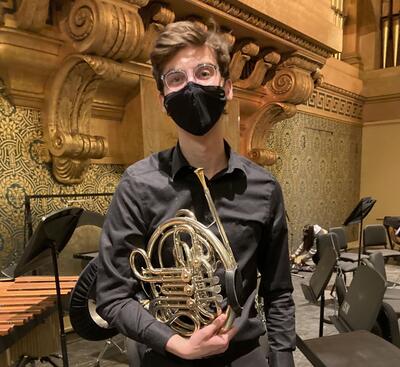 Me, holding my French horn in Woolsey Hall