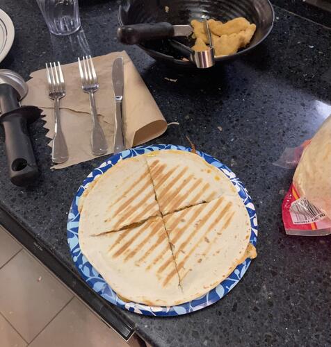 A quesadilla I made on a paper plate