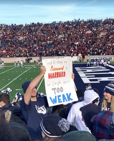 sign at football game that reads &quot;tried to change my password to Harvard but Google said it's too weak&quot;