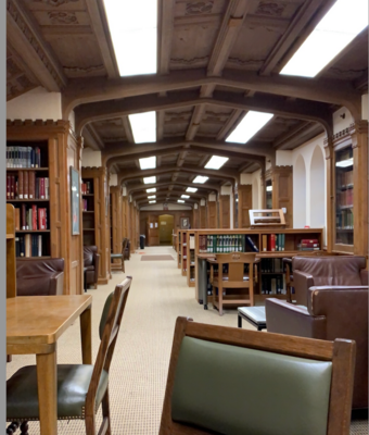 A large open room with bookshelves and chairs