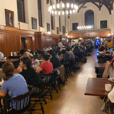 Timothy Dwight College full of students enjoying dinner. 