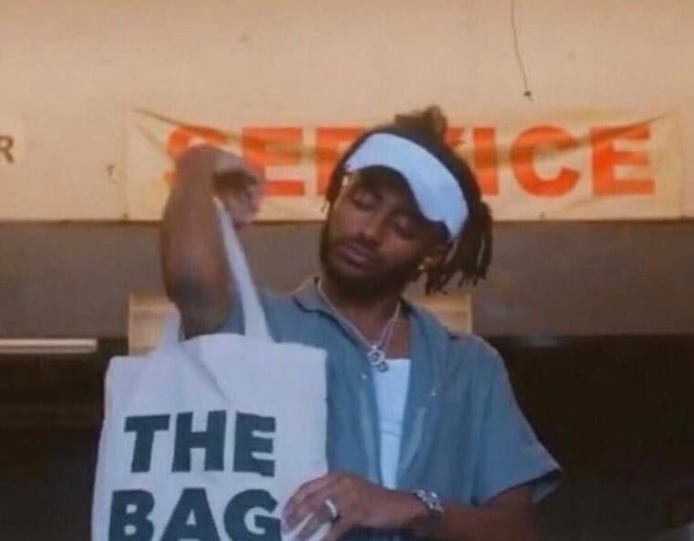 Aminé securing his bag, just as Yale helped me to do!