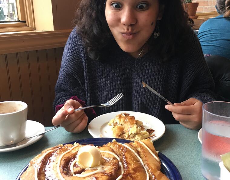 Student stares lovingly at pancakes