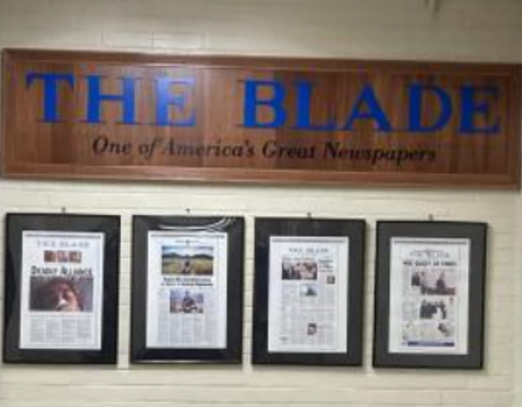 The Toledo Blade's sign and slogan with its Pulitzer -winning and -nominated articles below it