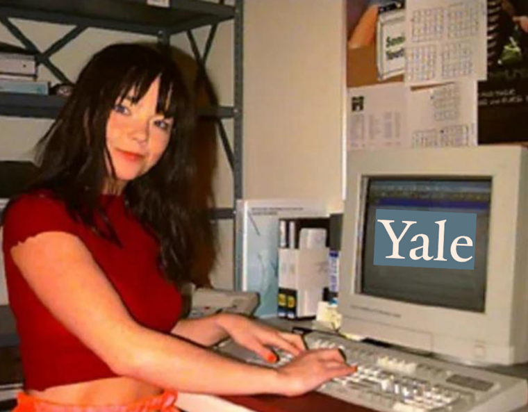 Bjork sitting at a computer that says "Yale"