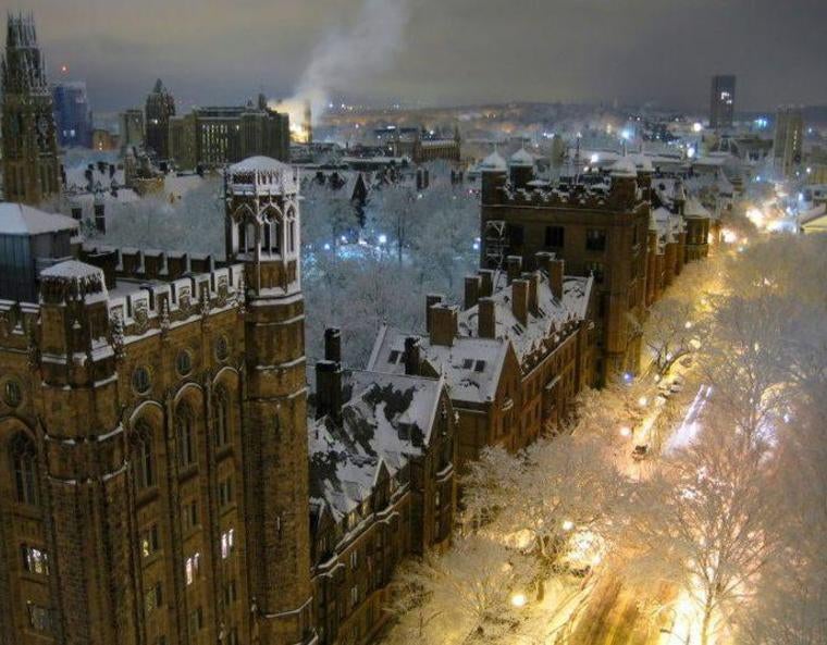 A nighttime aerial view of the Yale campus after a snowstorm.