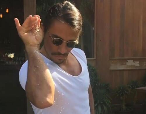 The famous picture of "Salt Bae" sprinkling salt on a steak.