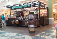 a Starbucks kiosk inside a grocery store