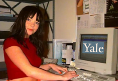 Bjork sitting at a computer that says "Yale"